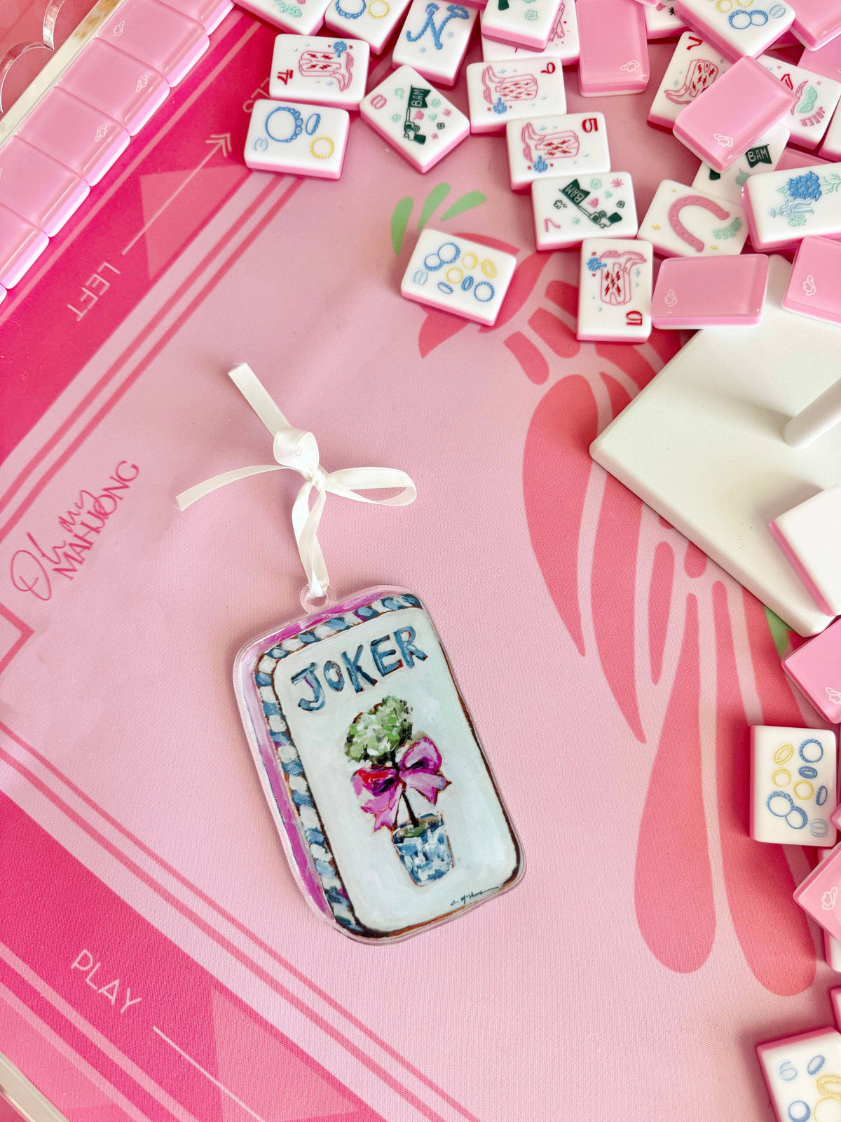 Mahjong Joker acrylic ornament on a pink Mahjong mat with tiles