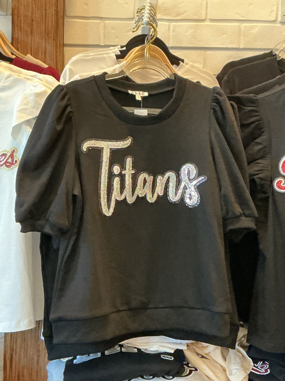 Black short sleeve puff sweatshirt with Titans appliqué