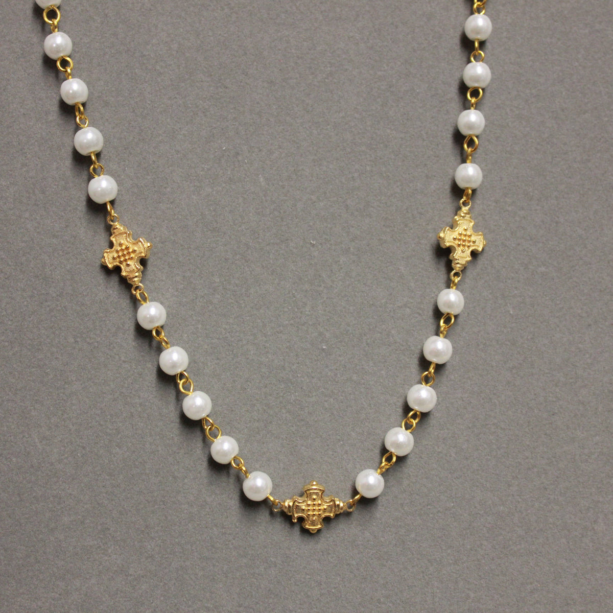 5 Cross Pearl Chain Necklace with white pearls and five matte gold crosses
