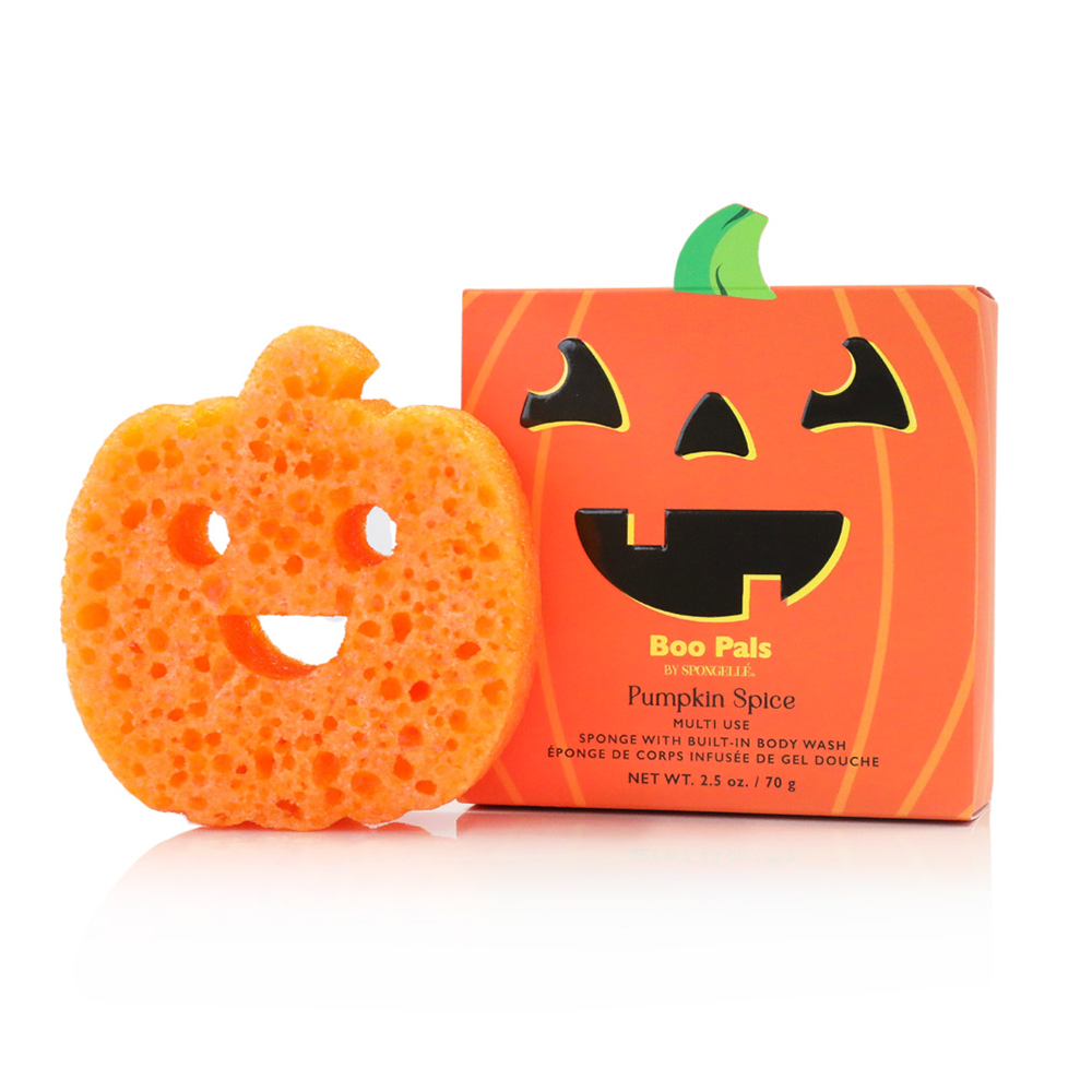 Pumpkin-shaped orange sponge body wash bar next to its orange packaging box with a jack-o'-lantern face and 'Boo Pols Pumpkin Spice' text, on a white background.