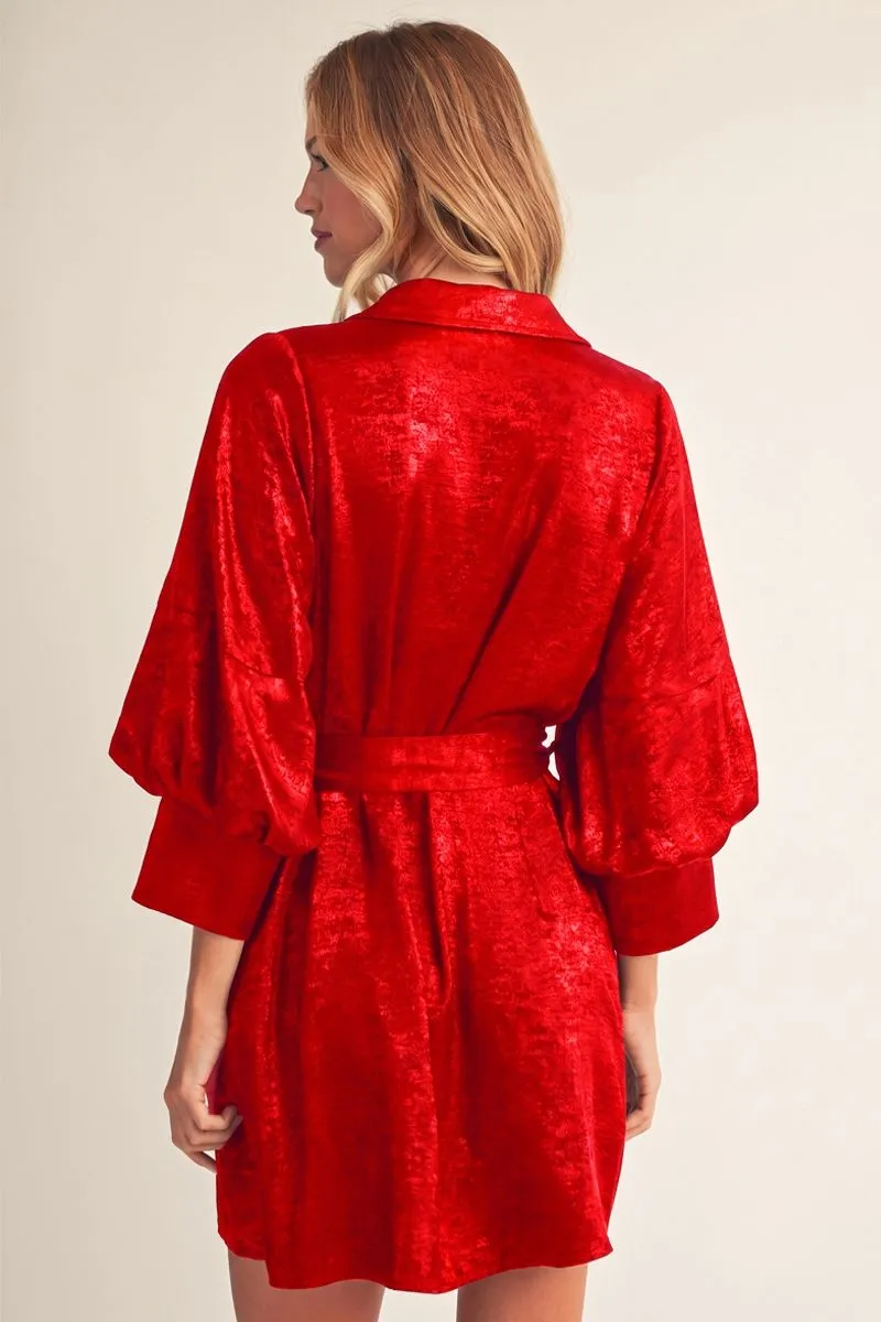 Back view of the red metallic shirt dress with waist tie