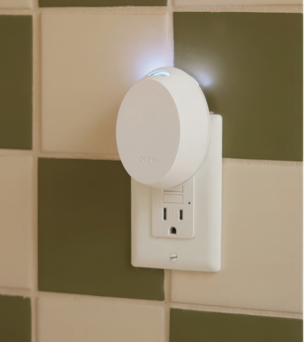 White Pura Mini Device plugged into the wall