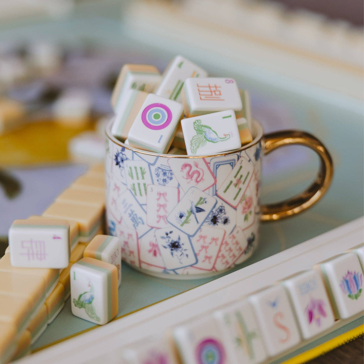 Mahjong tiles mug filled with game tiles on a Mahjong table