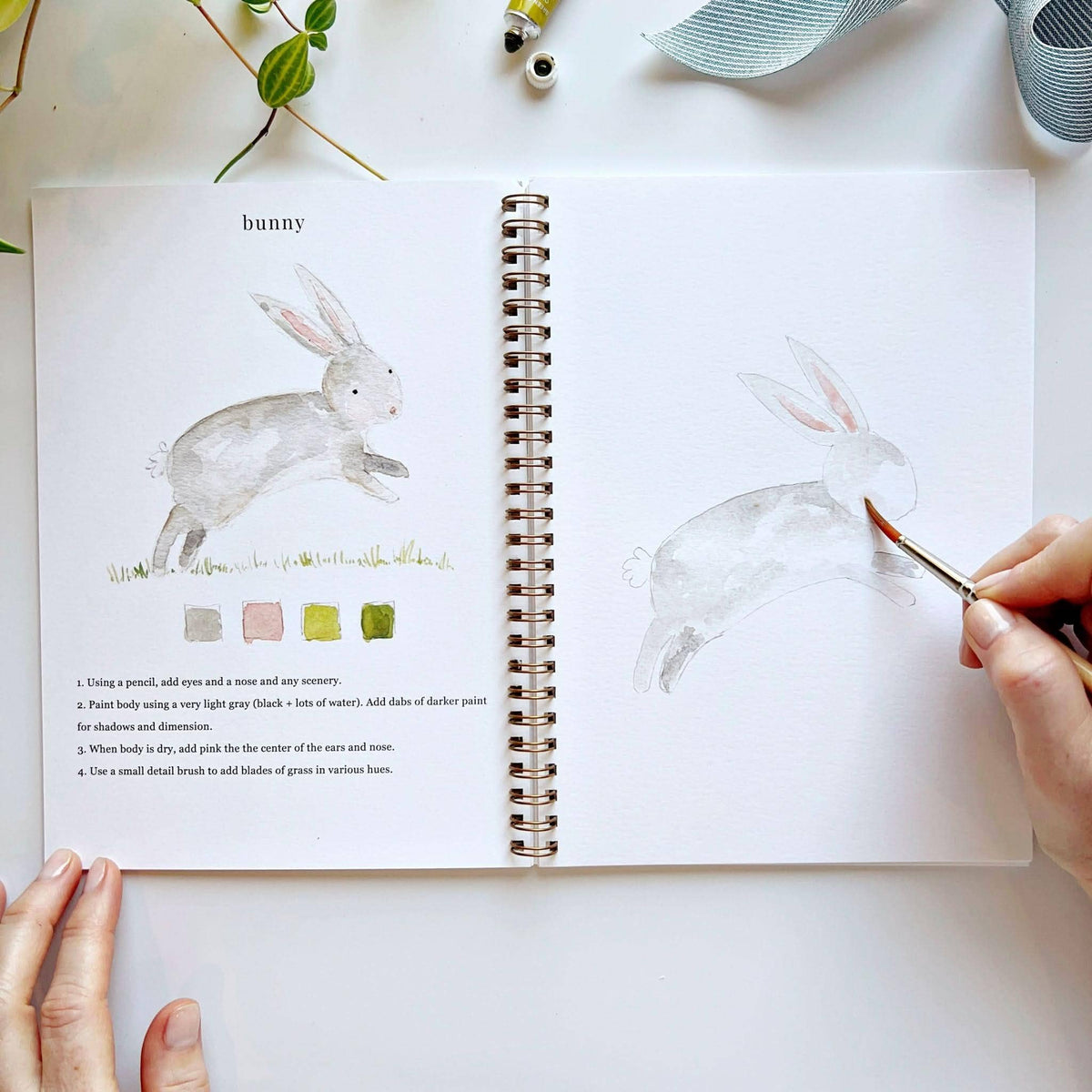 Painting a bunny in the Animals workbook
