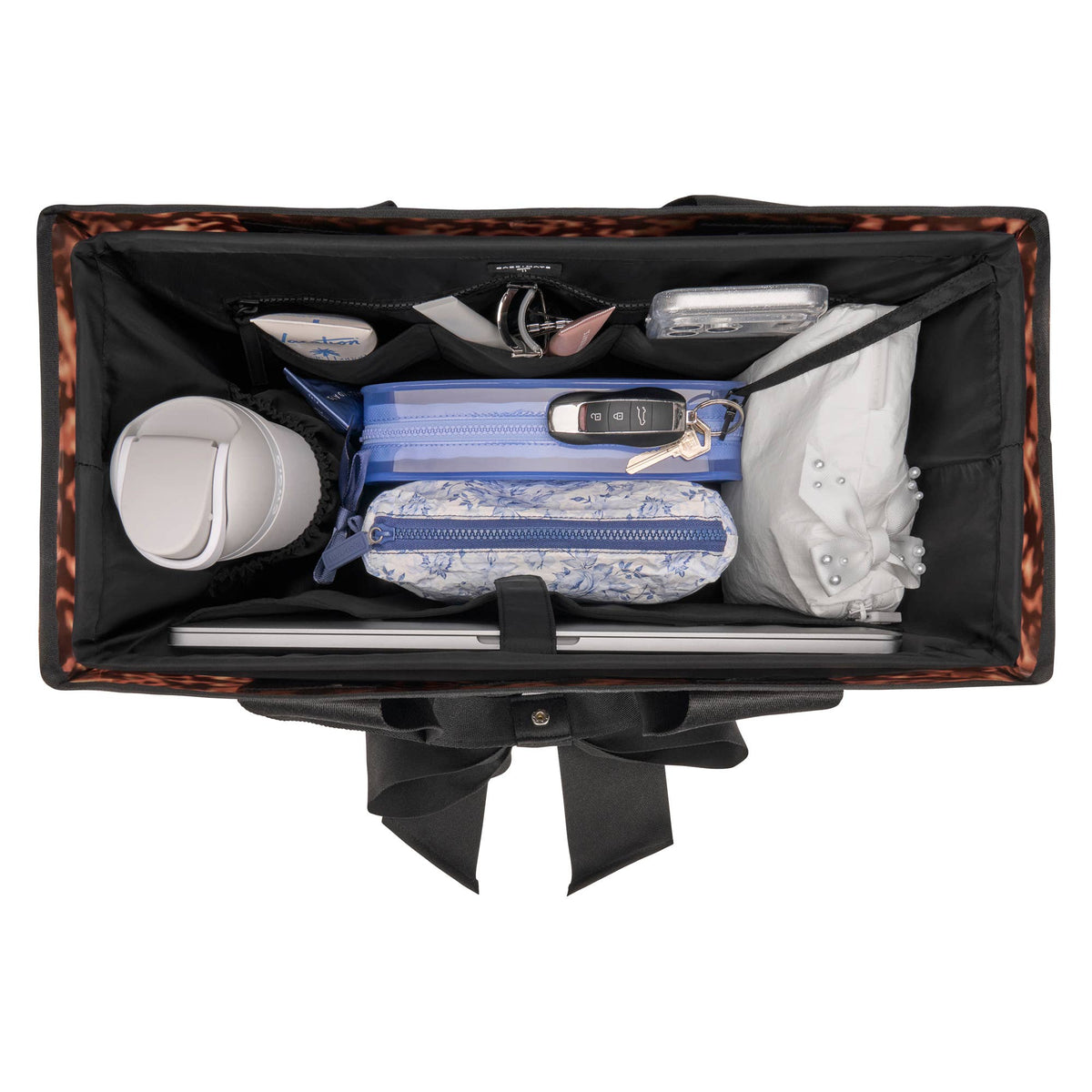 Top view of black tote organizer holding laptop, wallet, and phone