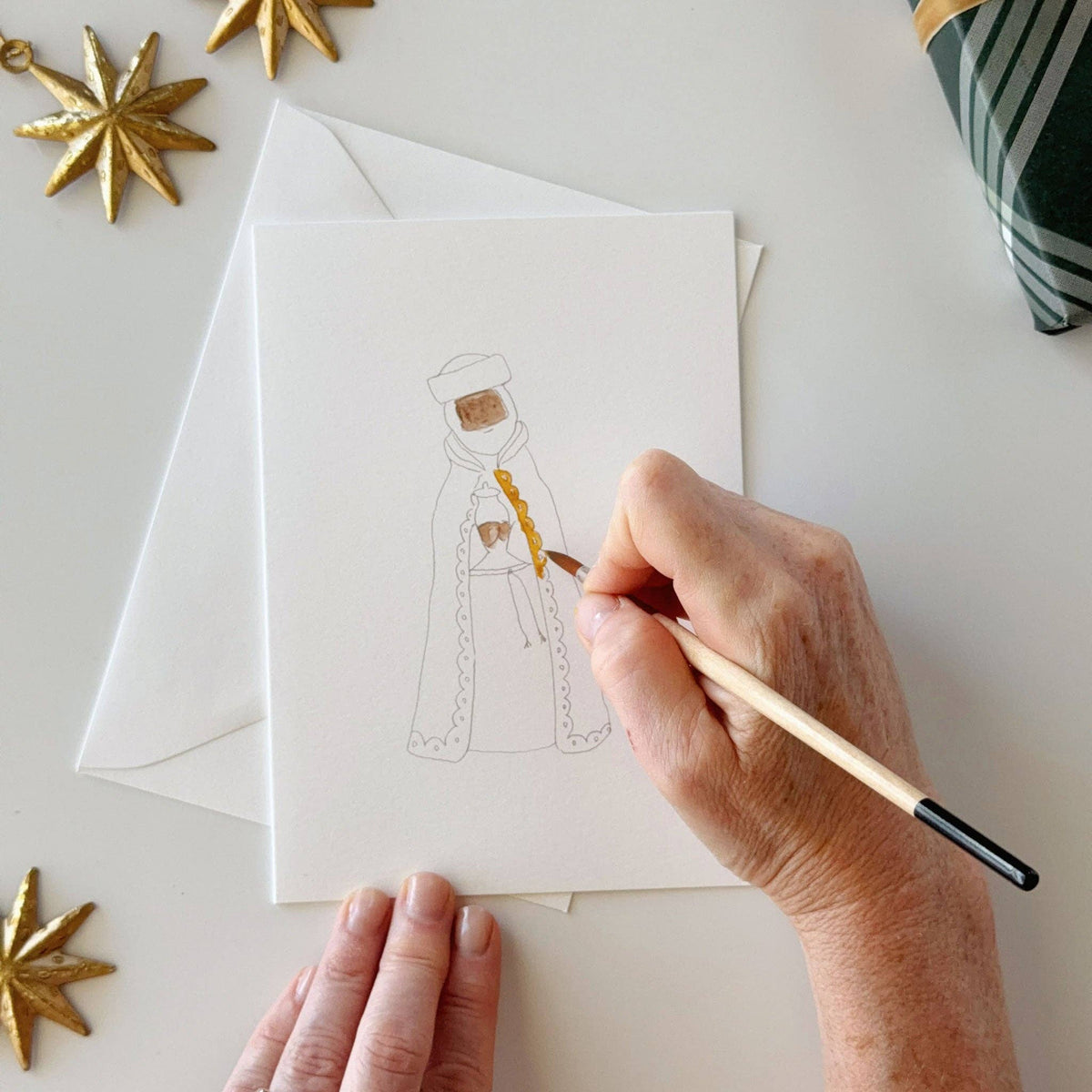 Painting a wise man on a nativity notecard