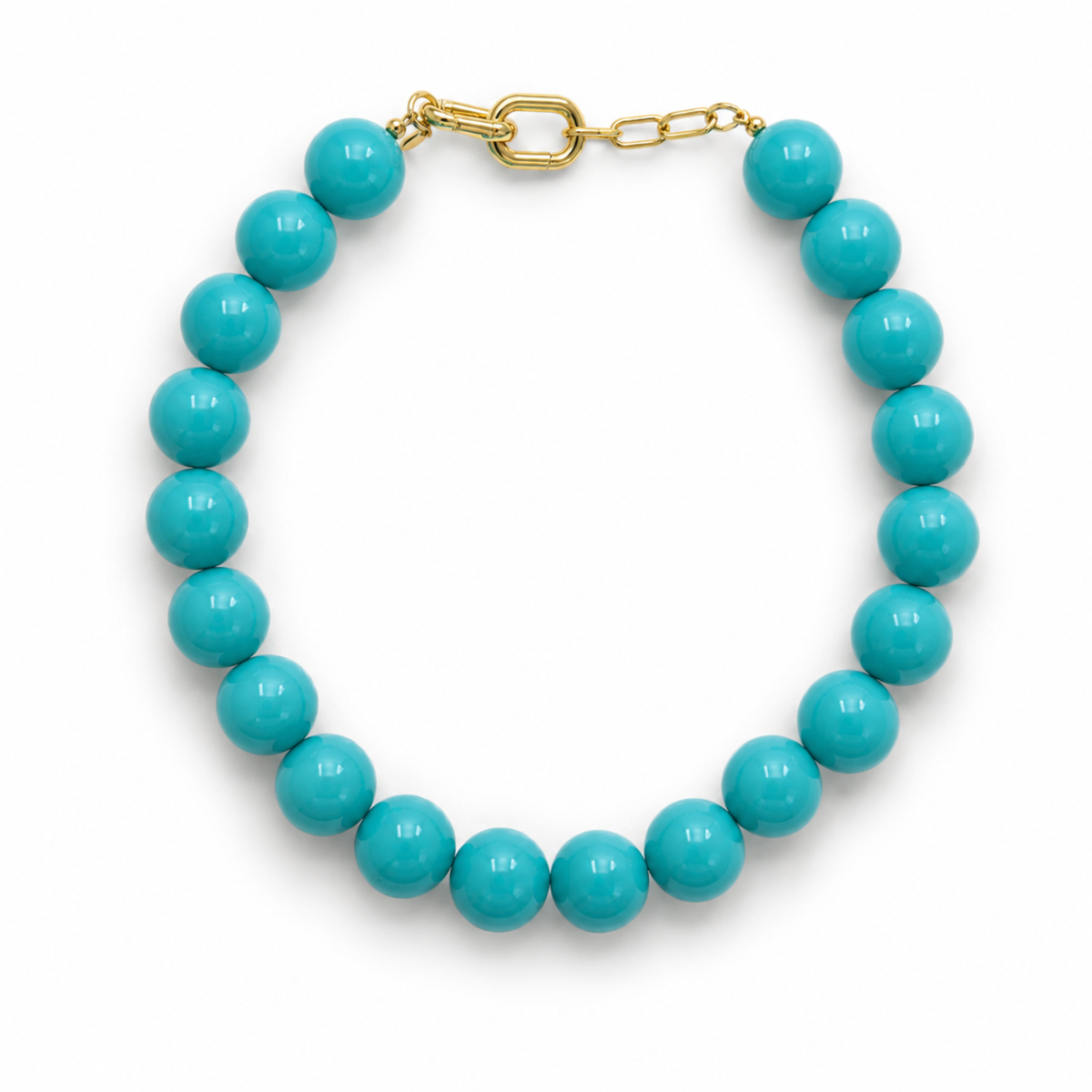 Turquoise beaded bracelet with gold chain on a white background