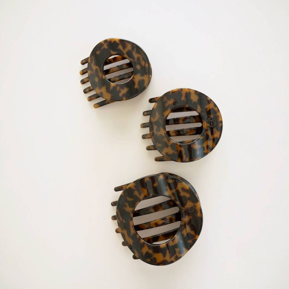 Three Tortoise flat circle hair clips grouped together