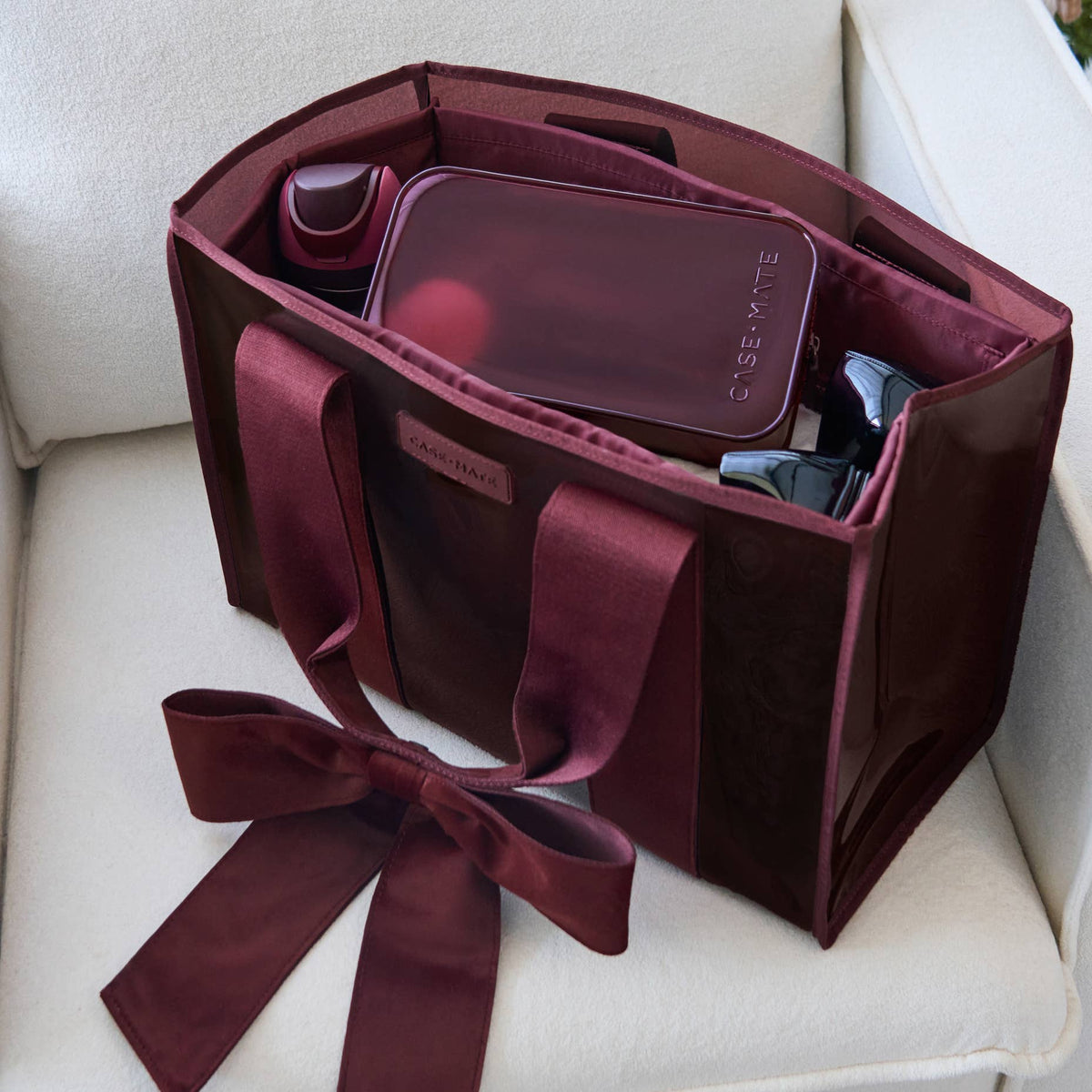 Red velvet bow jelly tote open and packed with everyday essentials
