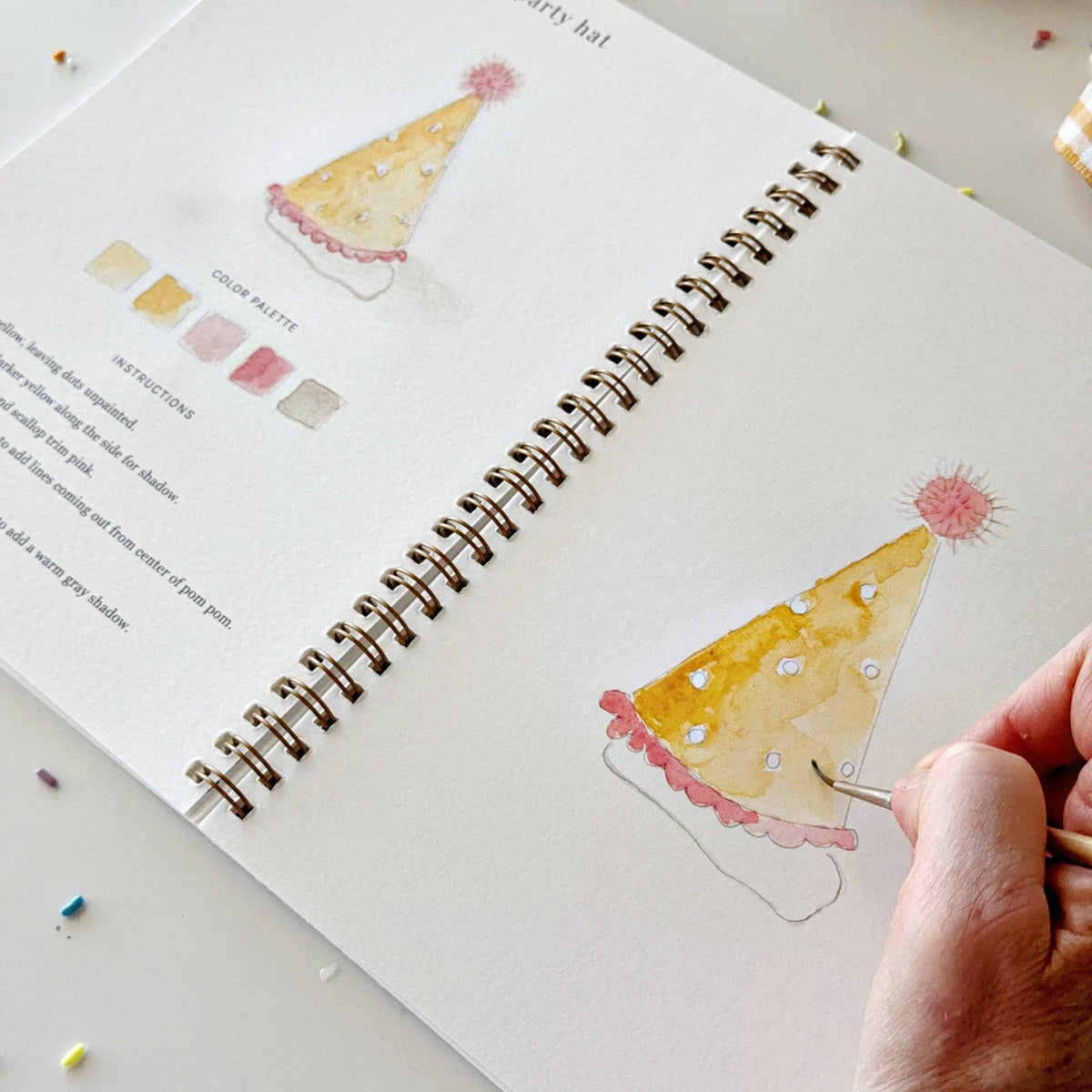Painting a party hat in the Celebrate workbook