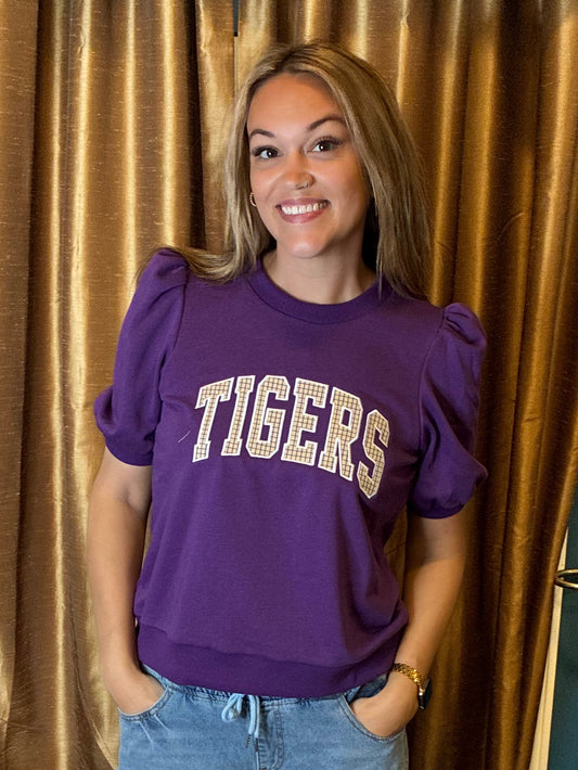 A women wearing a puff sleeve crewneck with Tigers in a plaid embroidery appliqué 