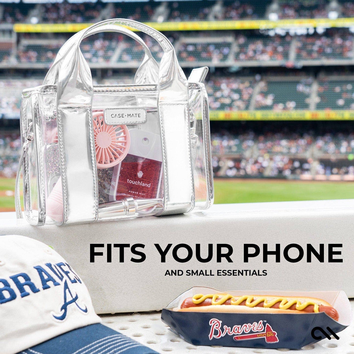 Clear handbag with chrome silver accents at a sporting event
