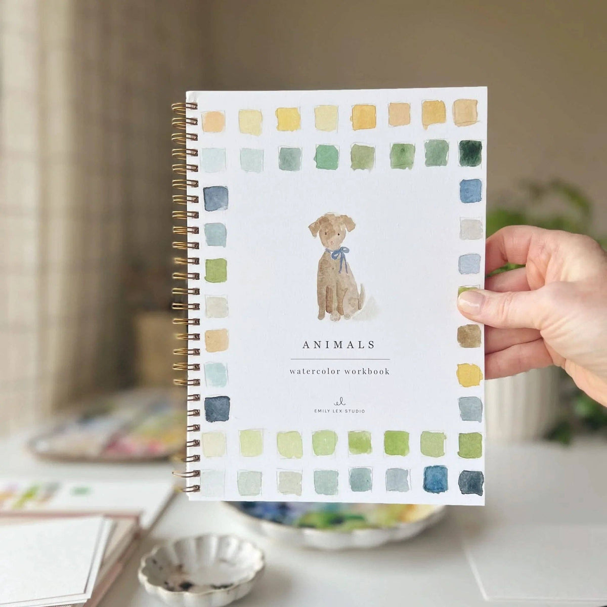 Holding the Animals watercolor workbook