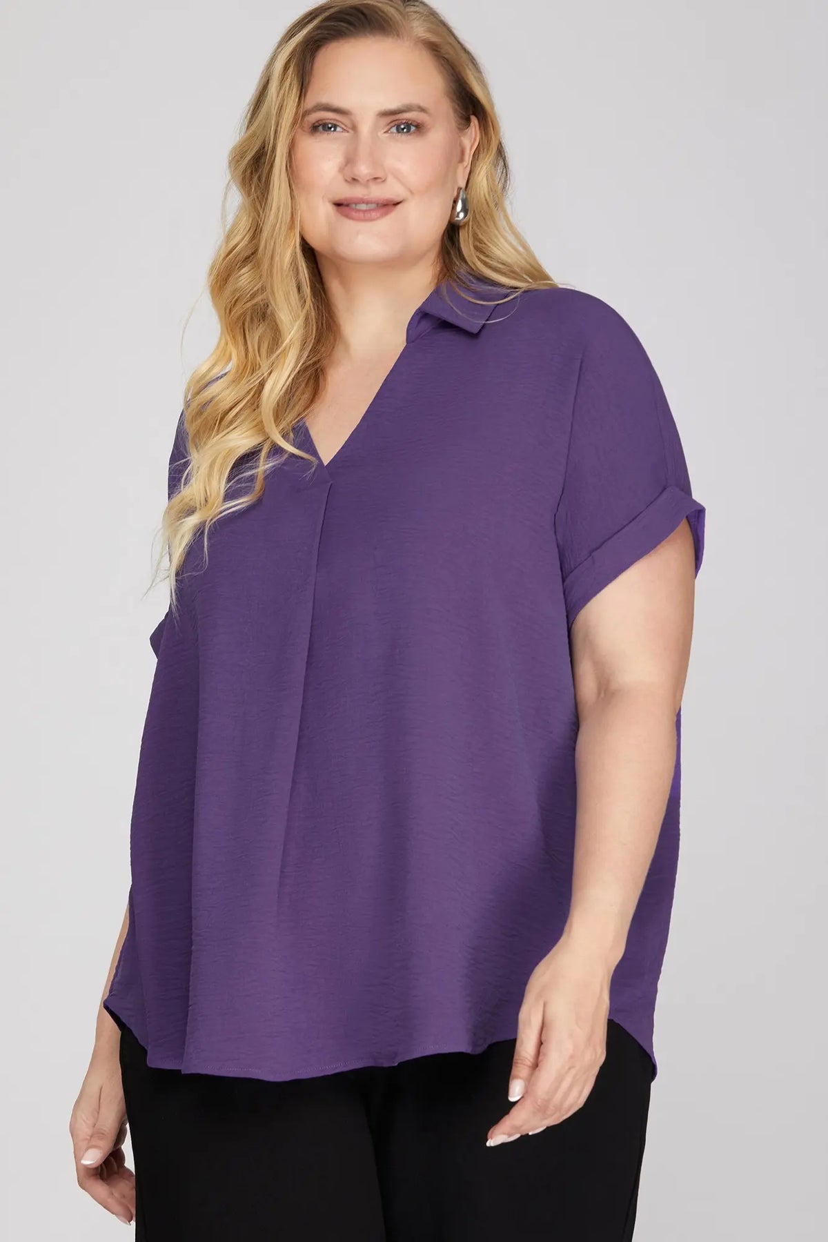 Women wearing a Puriple drop shoulder top 