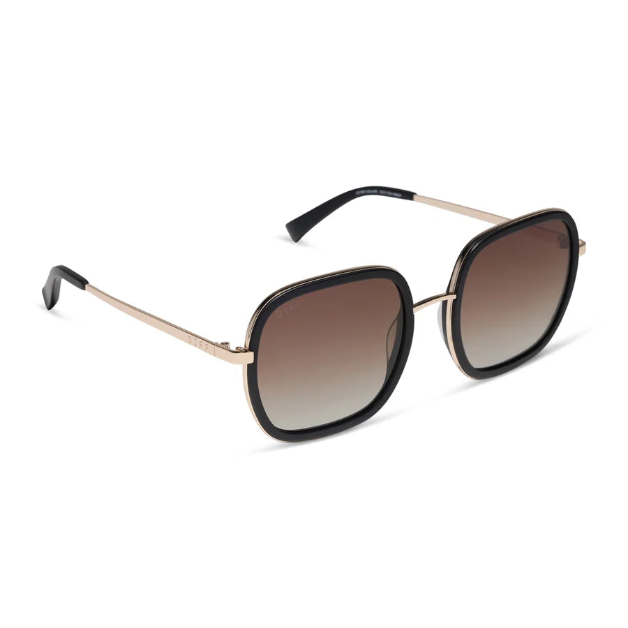 Oversized square sunglasses with a black acetate frame, gold metal temples, and brown gradient lenses, shown on a clean white background.