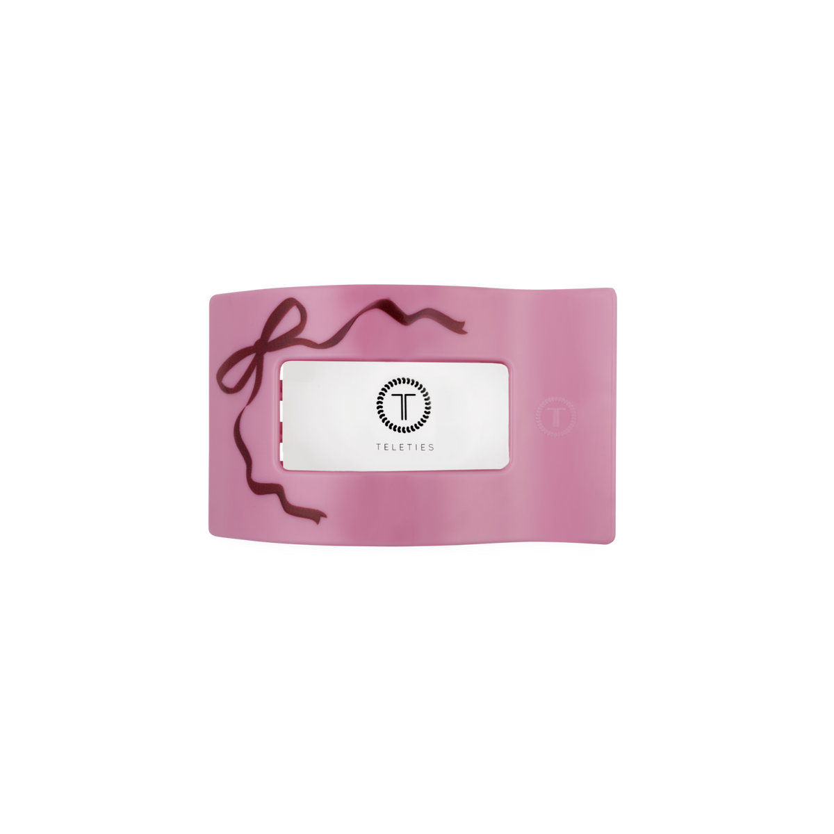 Underside of the pink Just Add a Bow small flat rectangle hair clip showing the TELETIES logo