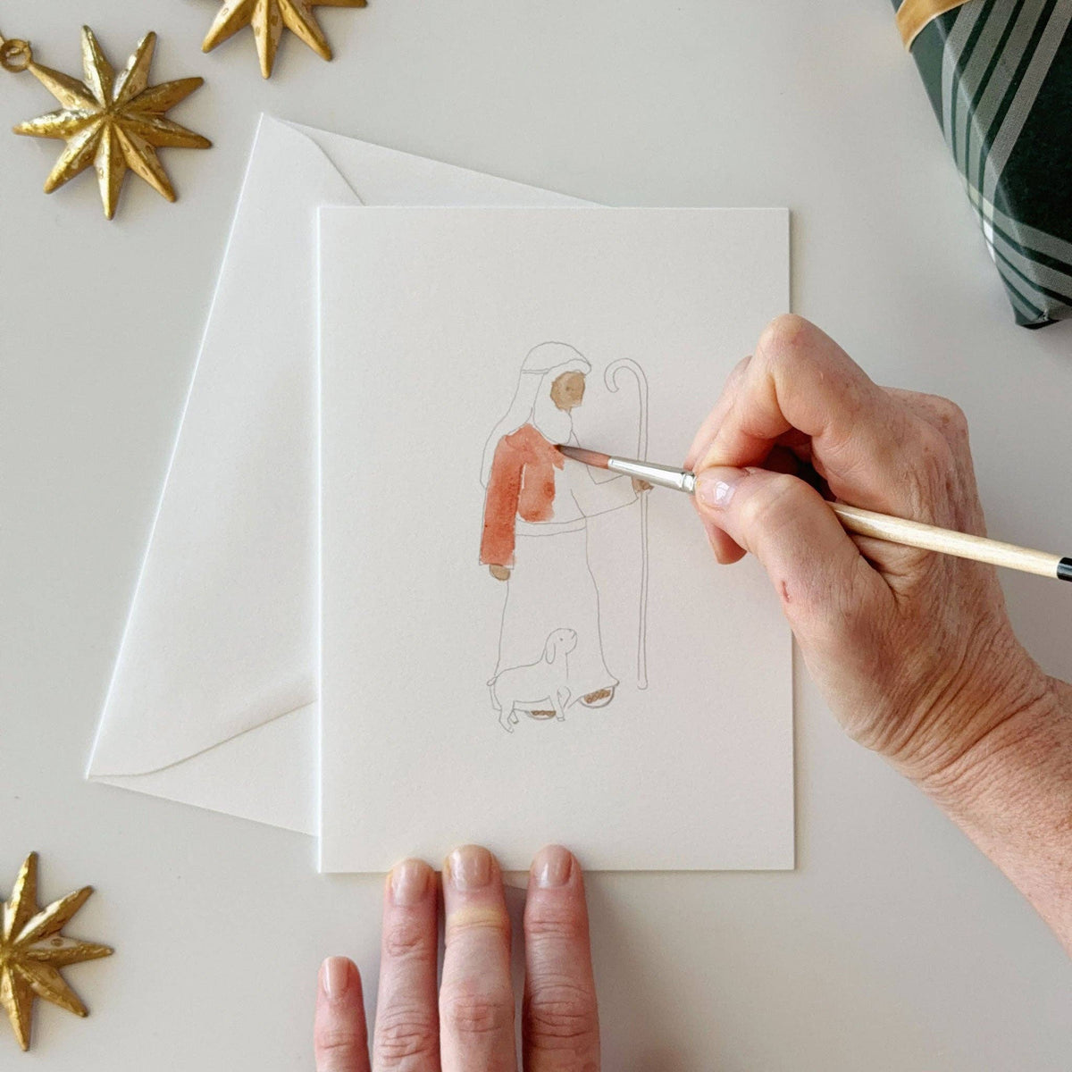 Painting a shepherd on a nativity notecard
