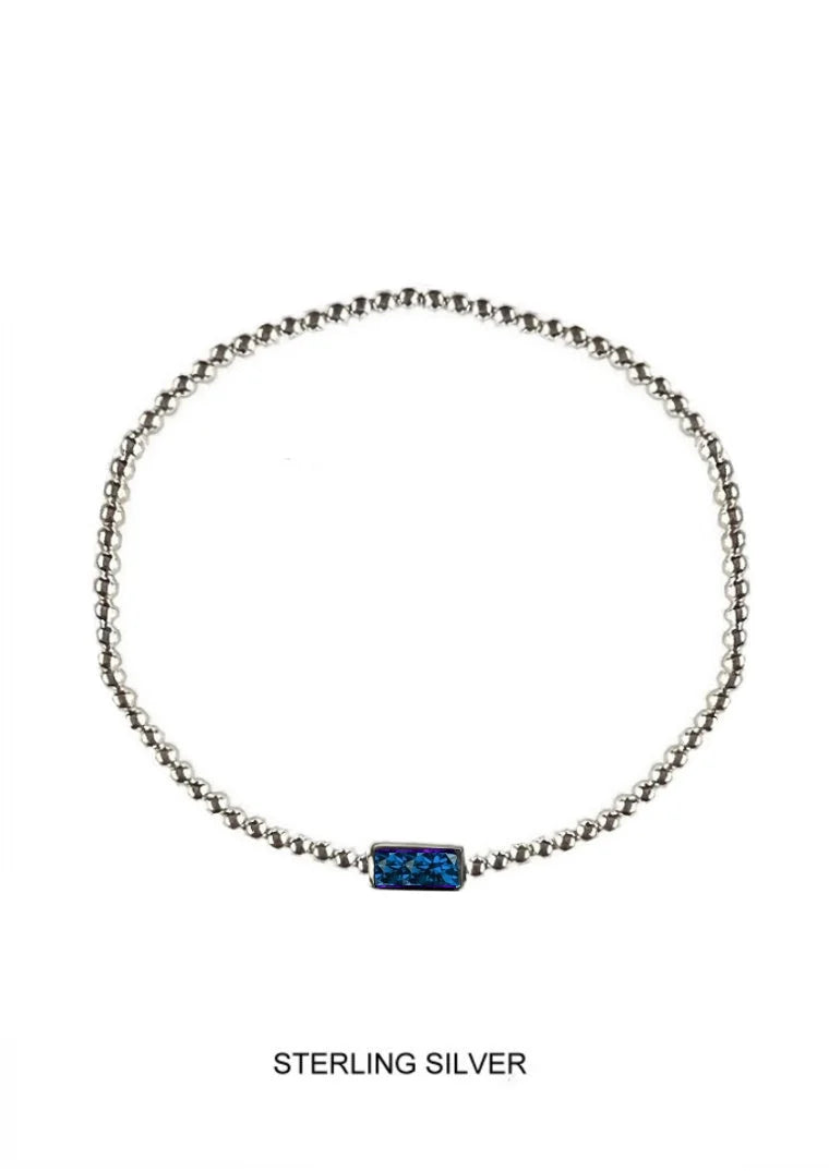 Sterling silver beaded necklace with a rectangular blue centerpiece, displayed on a clean white background with 'STERLING SILVER' text below.