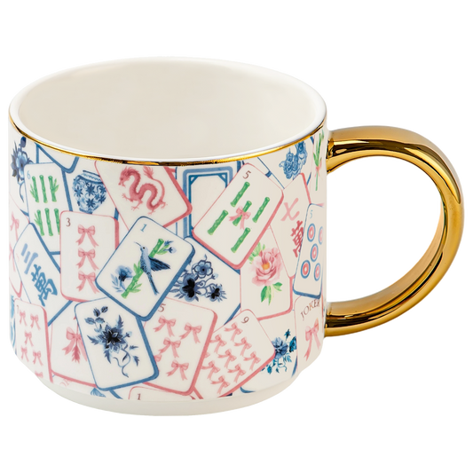 Mahjong tiles coffee mug with a gold handle on a white background