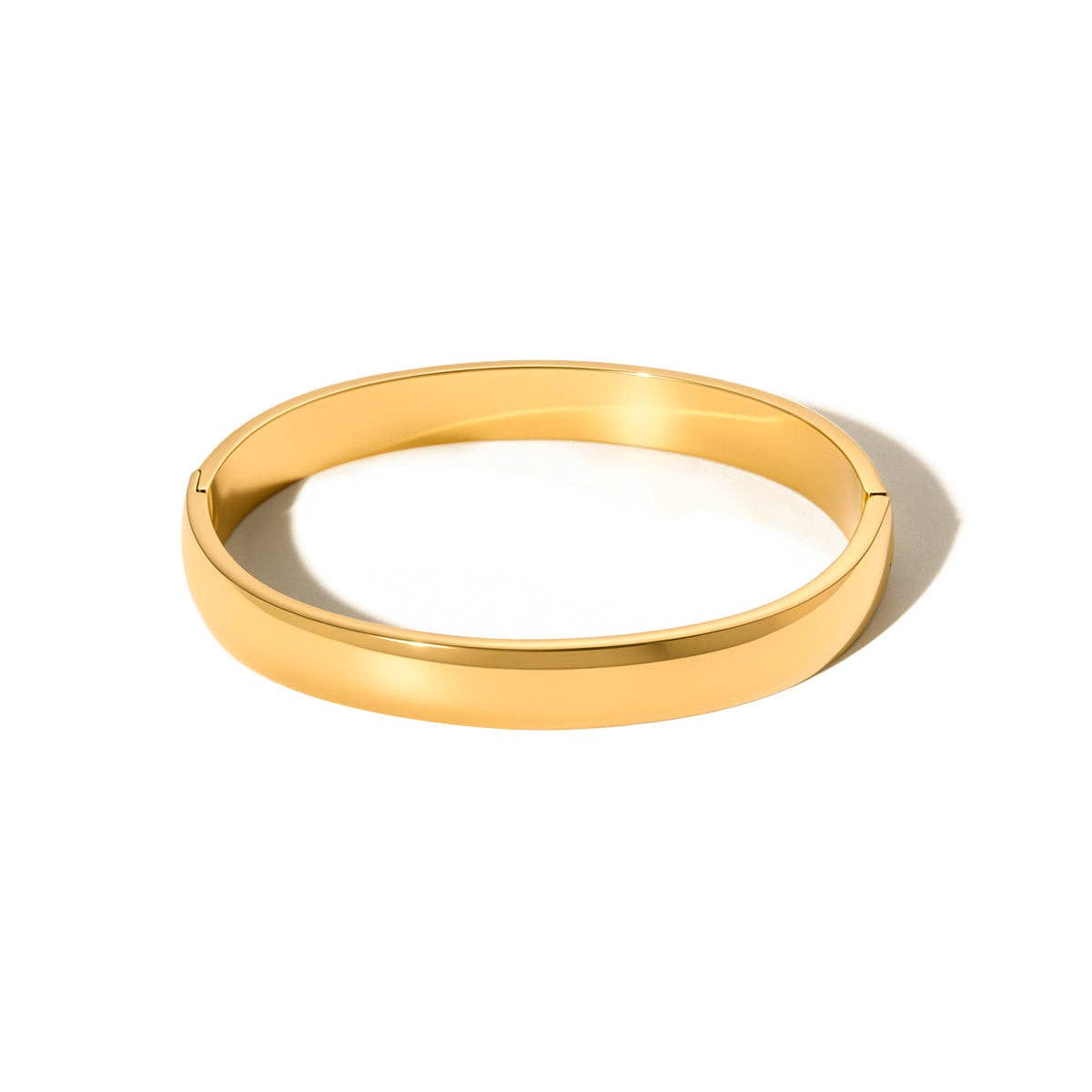 Gold bangle on a white background