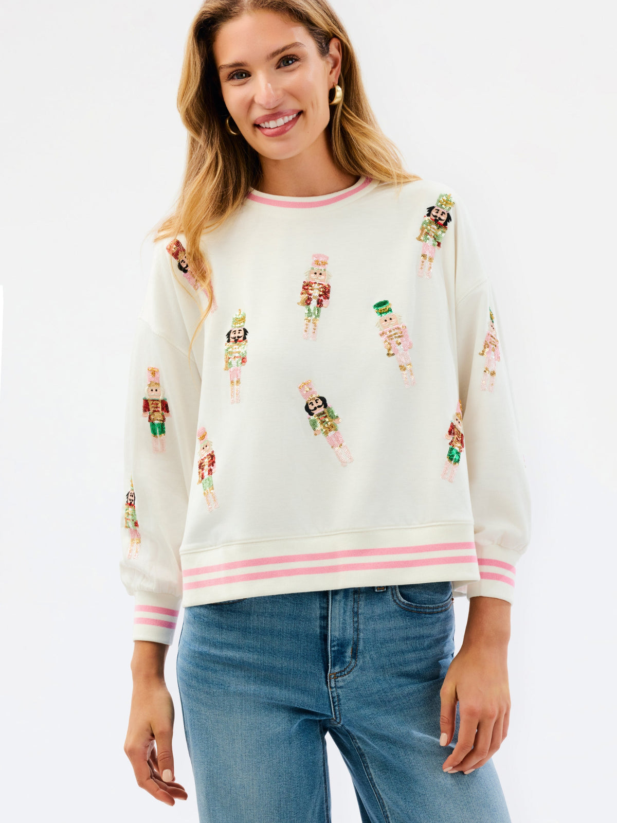 Ivory nutcracker crew neck sweatshirt with pink striped trim, front view