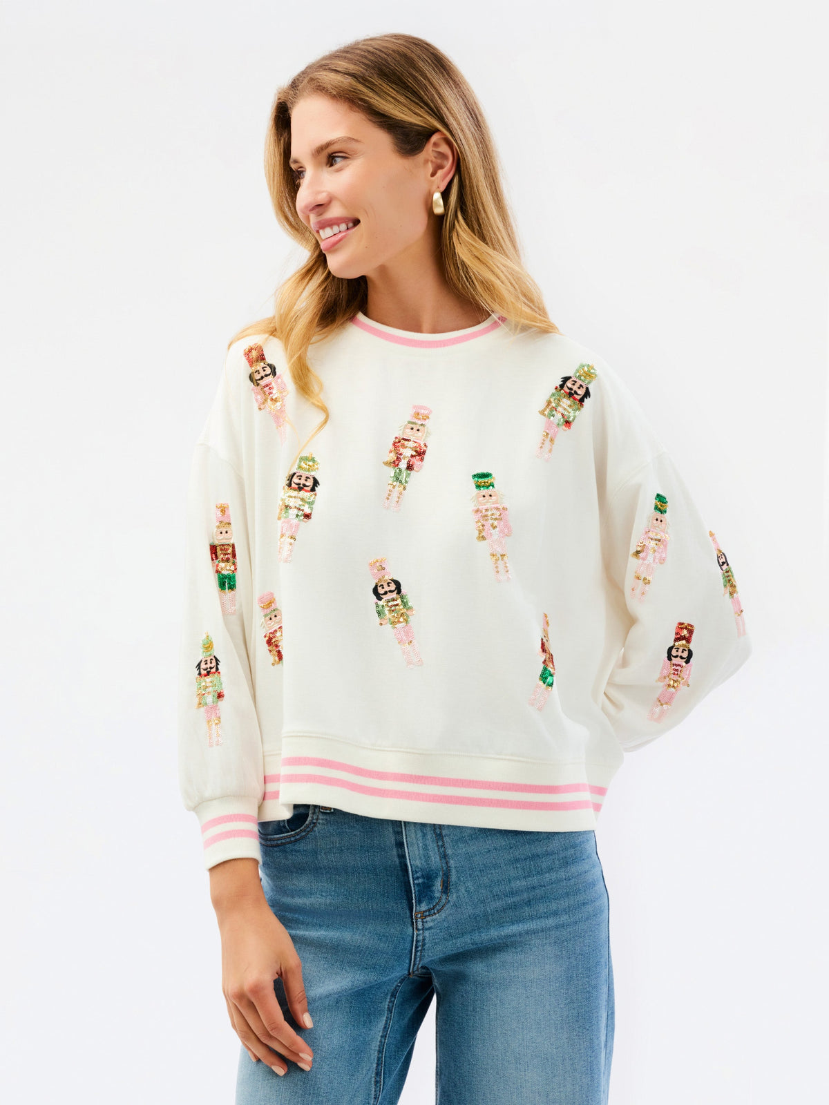 Ivory nutcracker sweatshirt styled with jeans