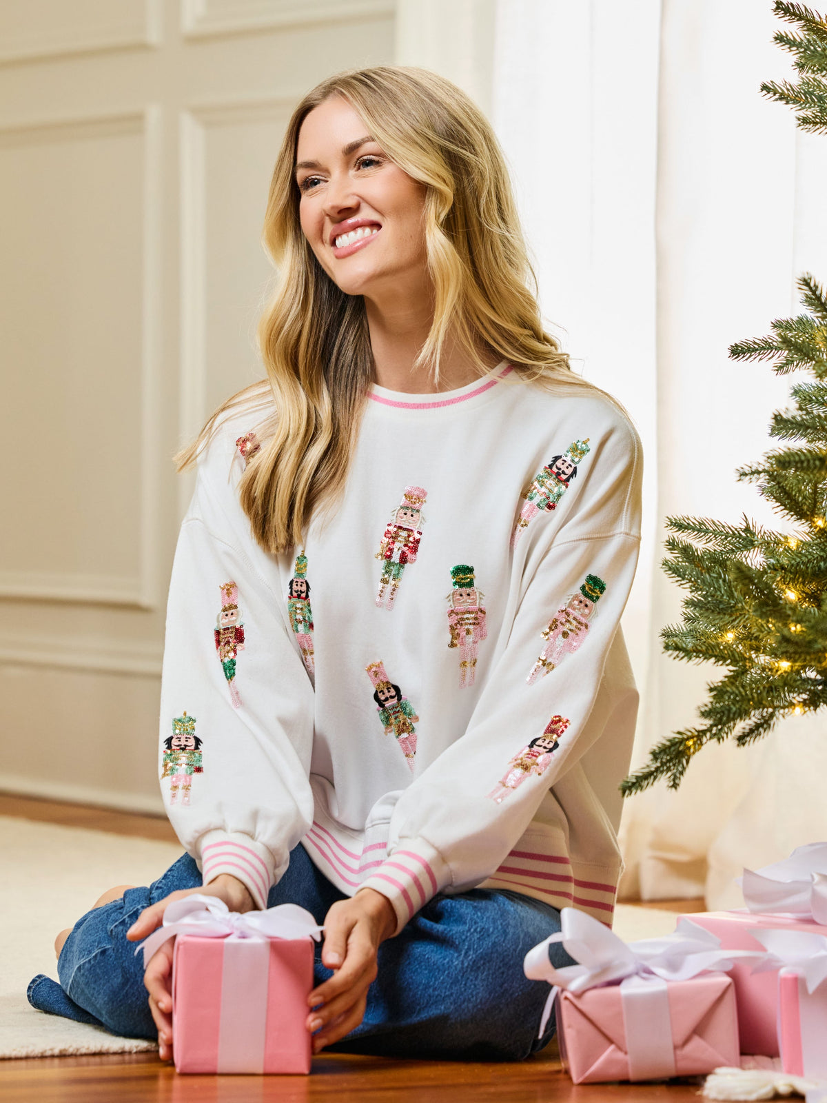 Woman in ivory nutcracker Christmas sweatshirt