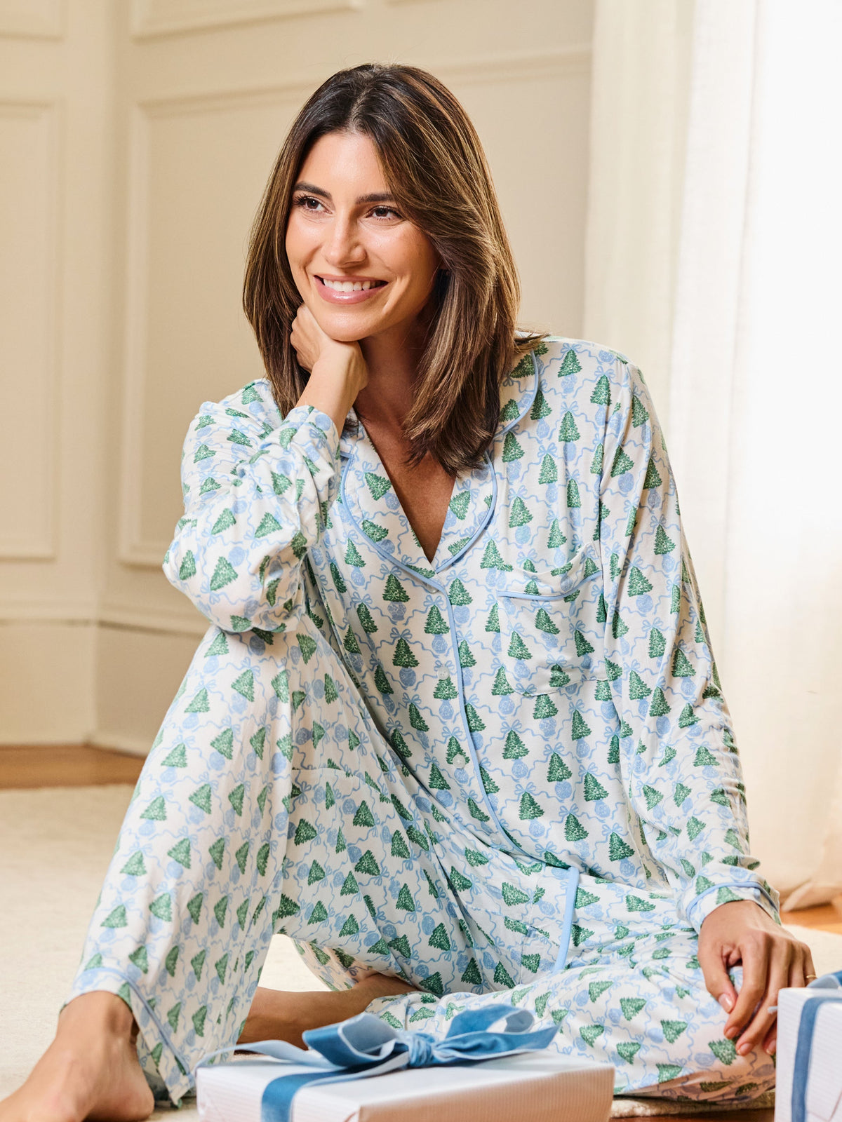Blue Christmas tree pajama set, seated view