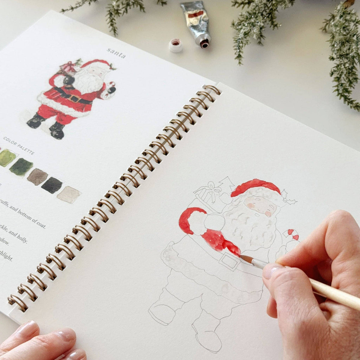 Painting Santa in the Christmas watercolor workbook