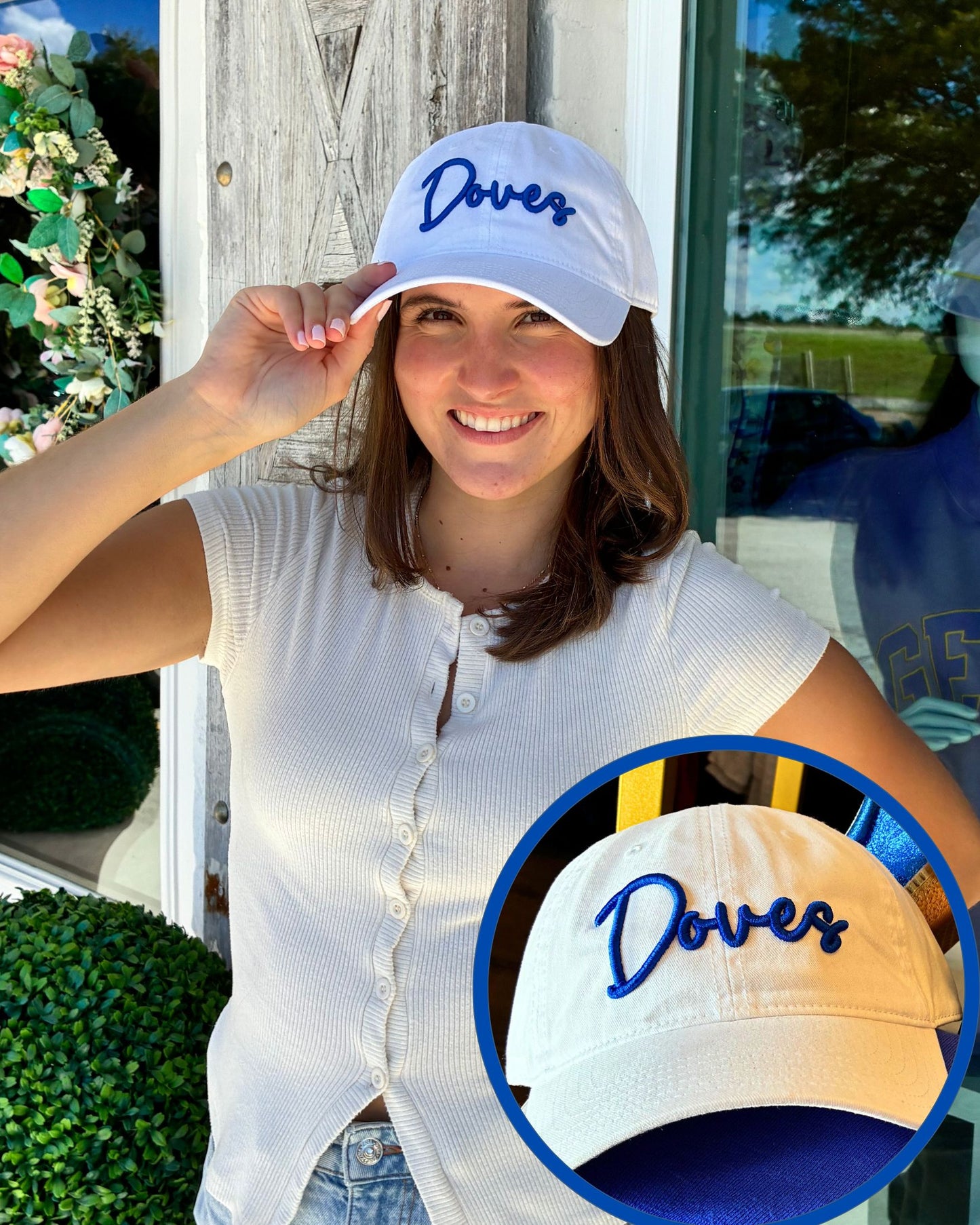A woman wearing a white baseball cap with blue embroidered 'Doves' text, posing outdoors near a storefront. A circular inset shows a close-up of the cap from the front.