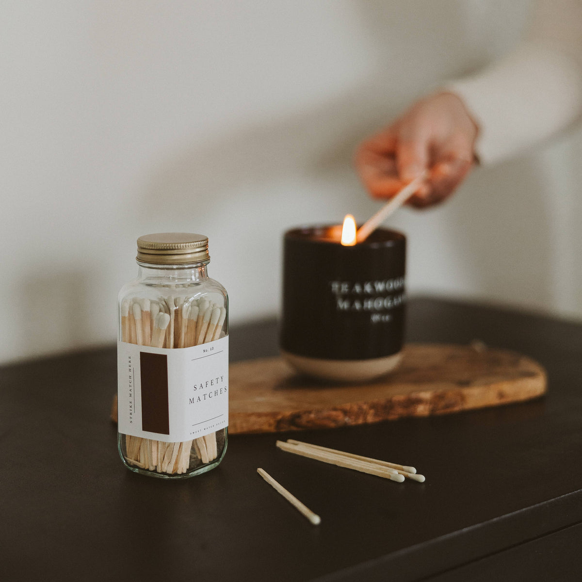 Lighting a candle with a white tip safety match