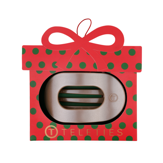 TELETIES Holiday Flat Round Ornament, a red present-shaped box with a bow holding a flat hair clip
