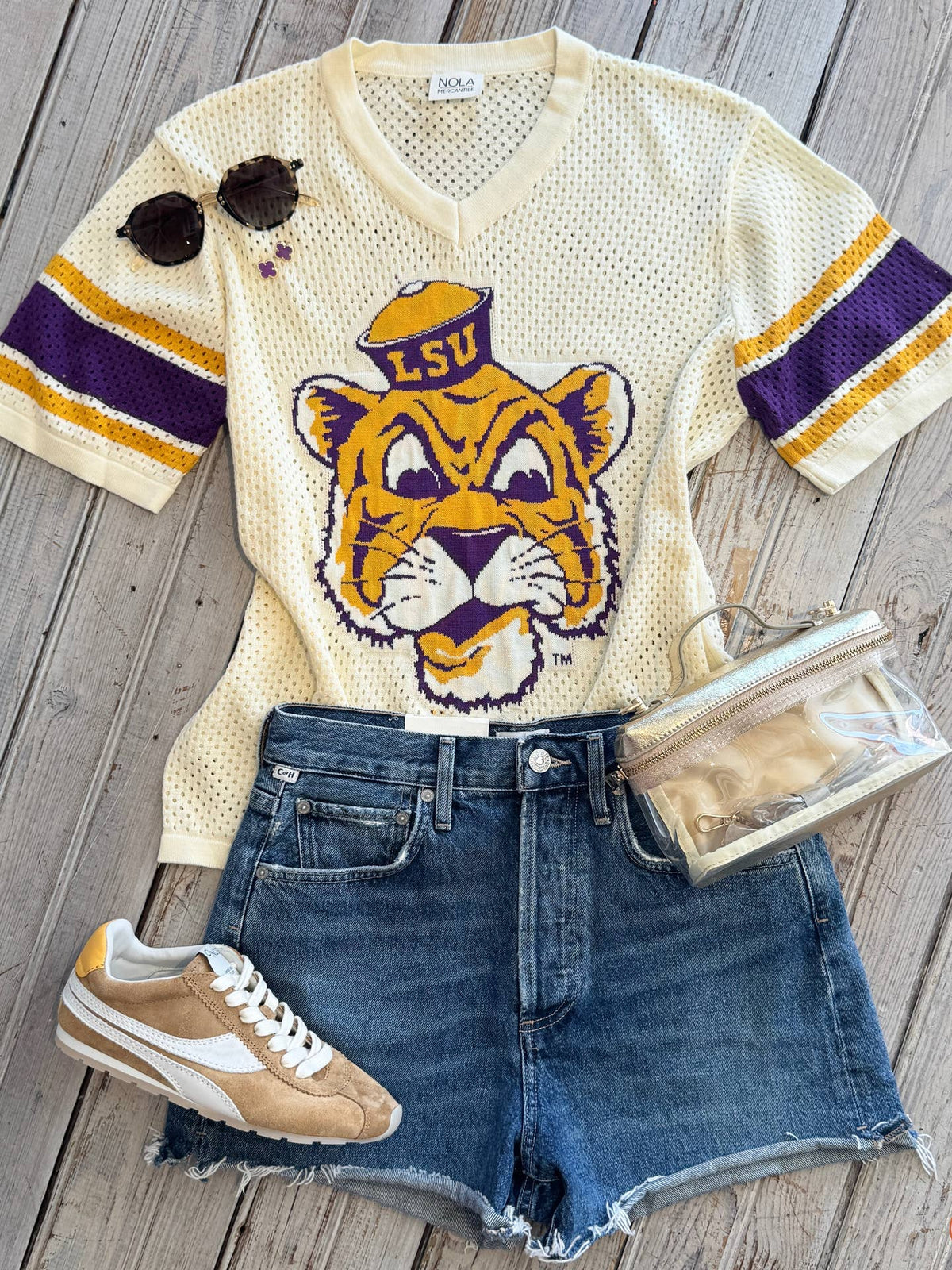 Flat lay Ivory Mike the Tiger Crochet top  with game day accessories