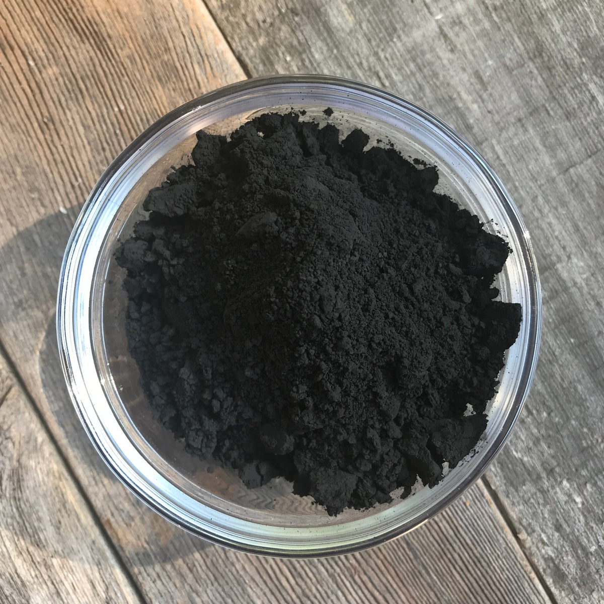 Bowl of activated charcoal powder used in the facial soap