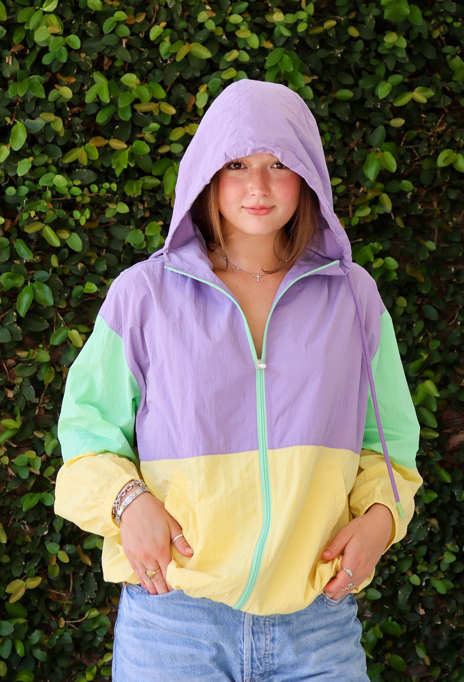 Lavender, mint, and yellow colorblock full-zip hooded Mardi Gras windbreaker, front view