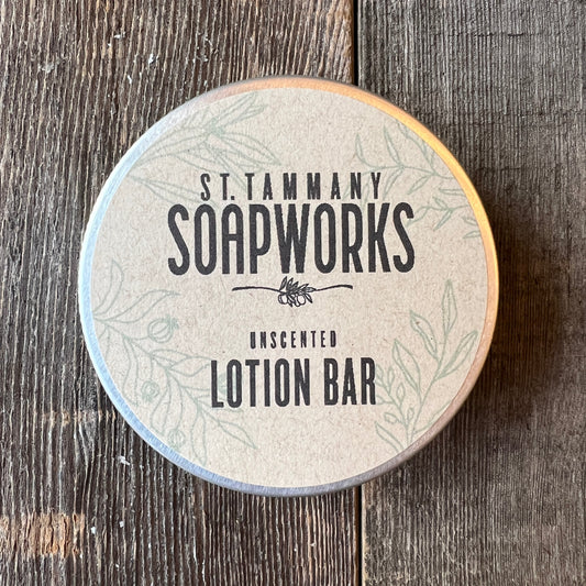 Unscented Lotion Bar tin by St. Tammany Soapworks on rustic wood