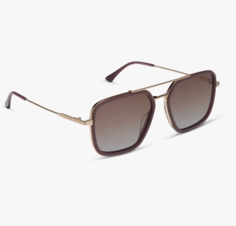 A pair of aviator-style sunglasses with dusty purple frames, gold metal double bridge and temples, and gradient cocoa and light blue lenses, shown on a clean white background.