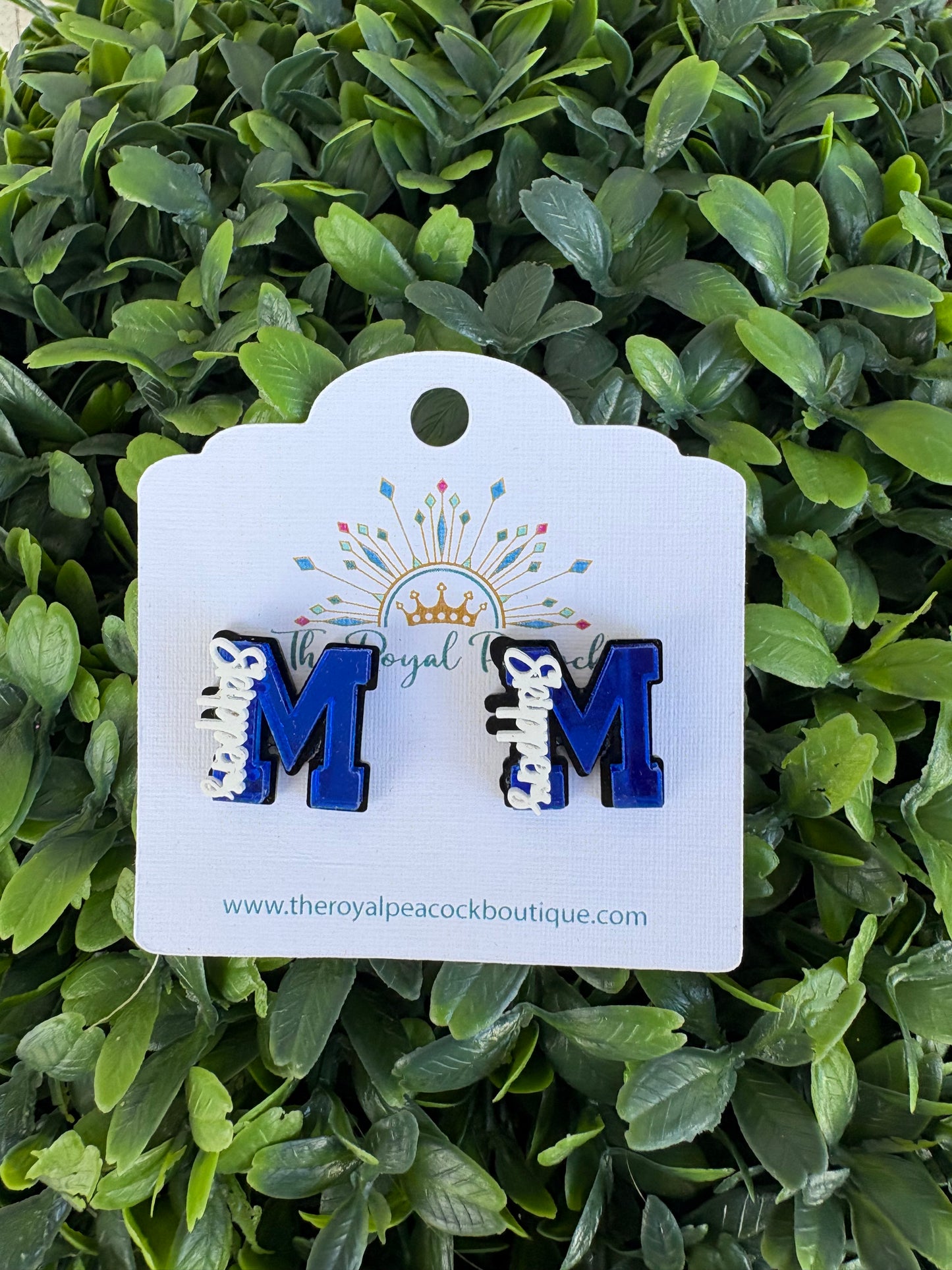 Glitter M outline in black stud with Skippers written on it 