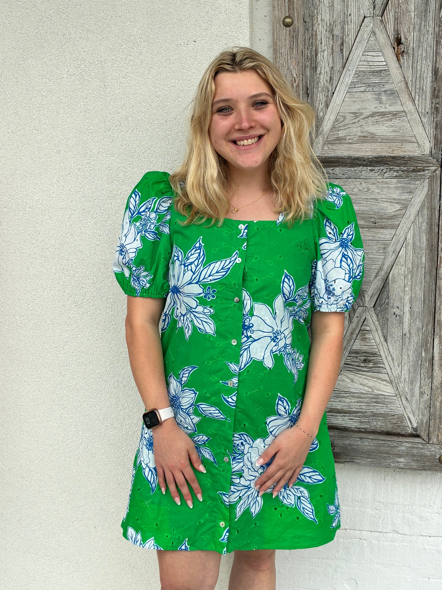 Woman wearing a green floral dress