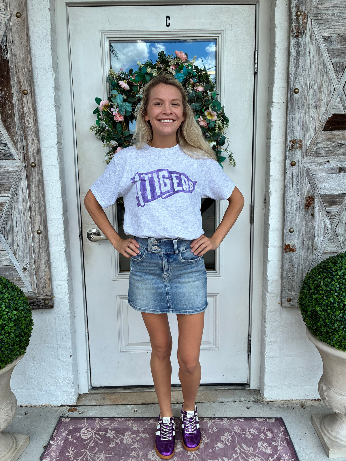 Heather gray t shirt with a watercolor artist painted design of a pennant flag with Tigers in purple