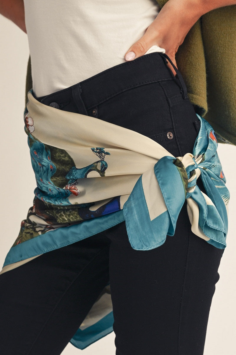 women wearing a peacock scarf around her waist