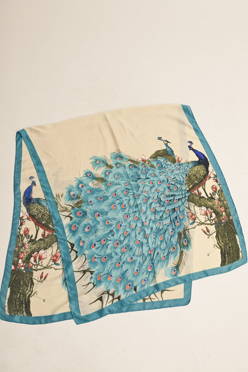 Peacock scarf with teal border and floral accents