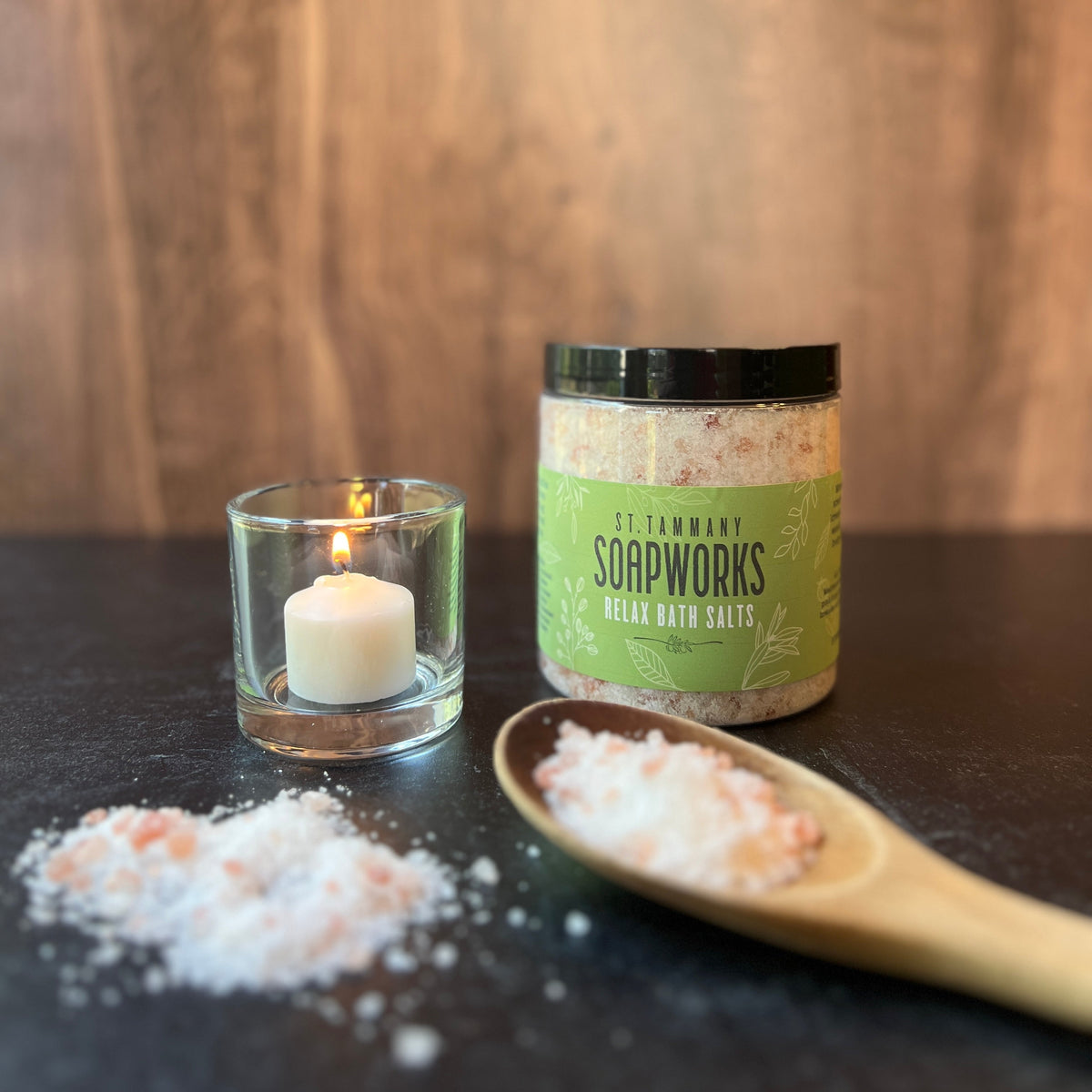 RELAX Bath Salts jar with a candle and a scoop of salts