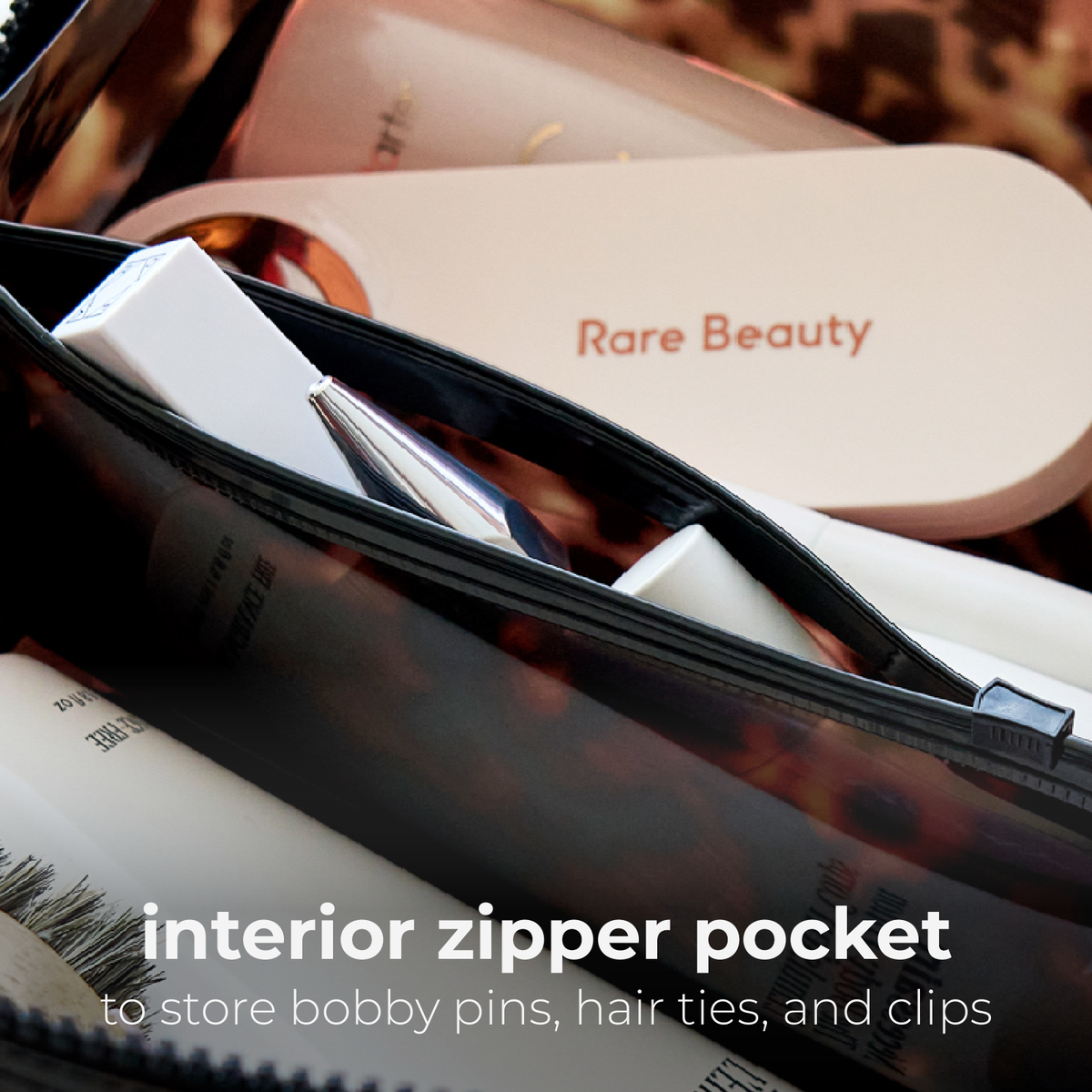 Interior zipper pocket of the tortoiseshell jelly cosmetic bag