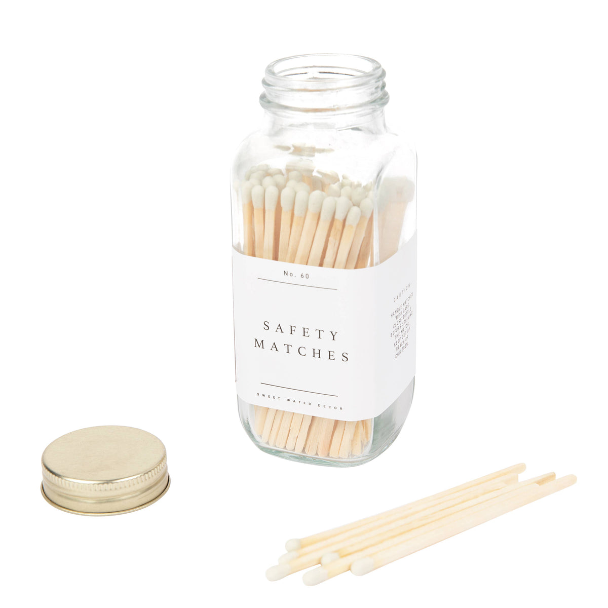 Jar of white tip safety matches with its gold lid off