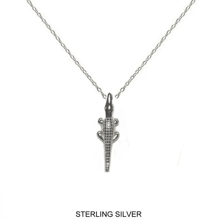 Sterling silver alligator pendant necklace on a delicate link chain, shown against a plain white background with 'STERLING SILVER' text at the bottom.
