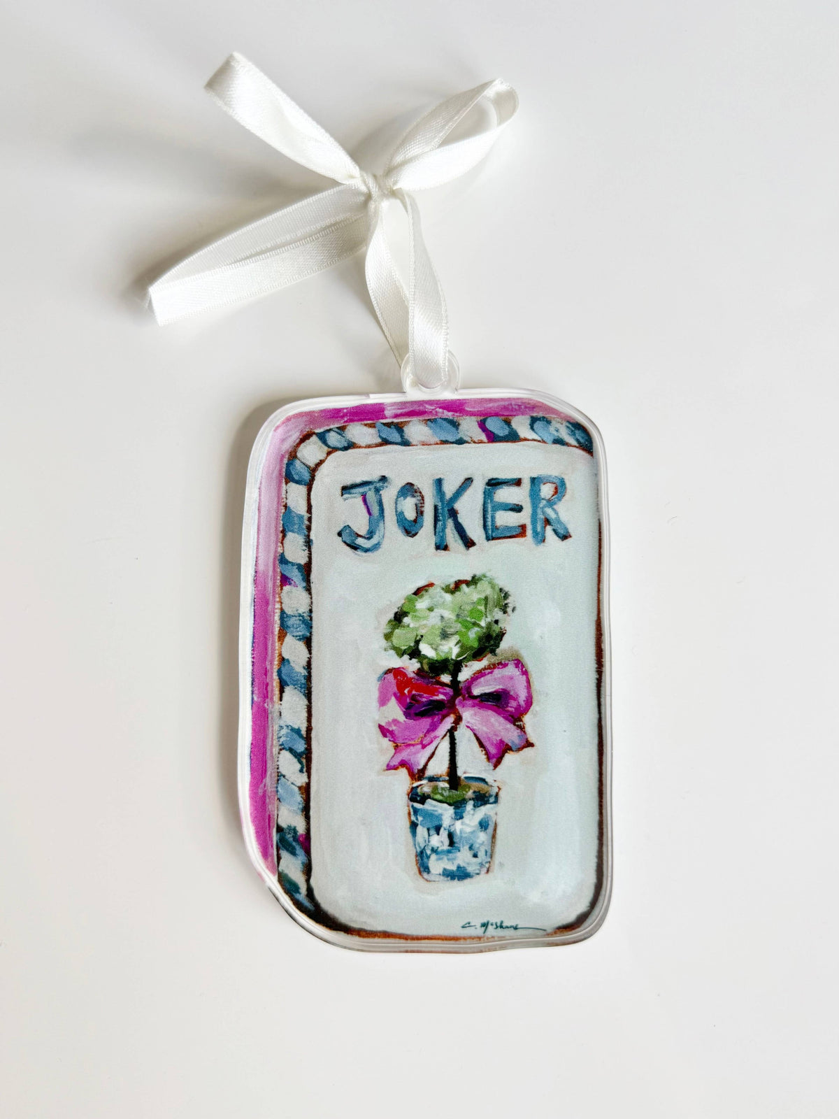Clear acrylic Mahjong Joker ornament with a topiary and pink bow on a white ribbon