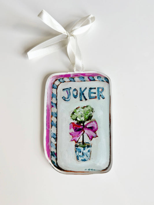 Clear acrylic Mahjong Joker ornament with a topiary and pink bow on a white ribbon