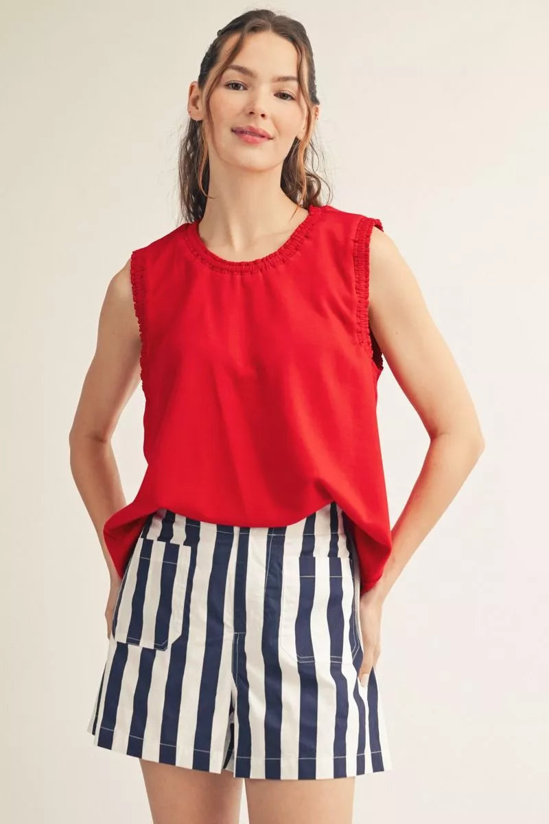 Red sleeveless smocked edge tank with navy and white striped shorts