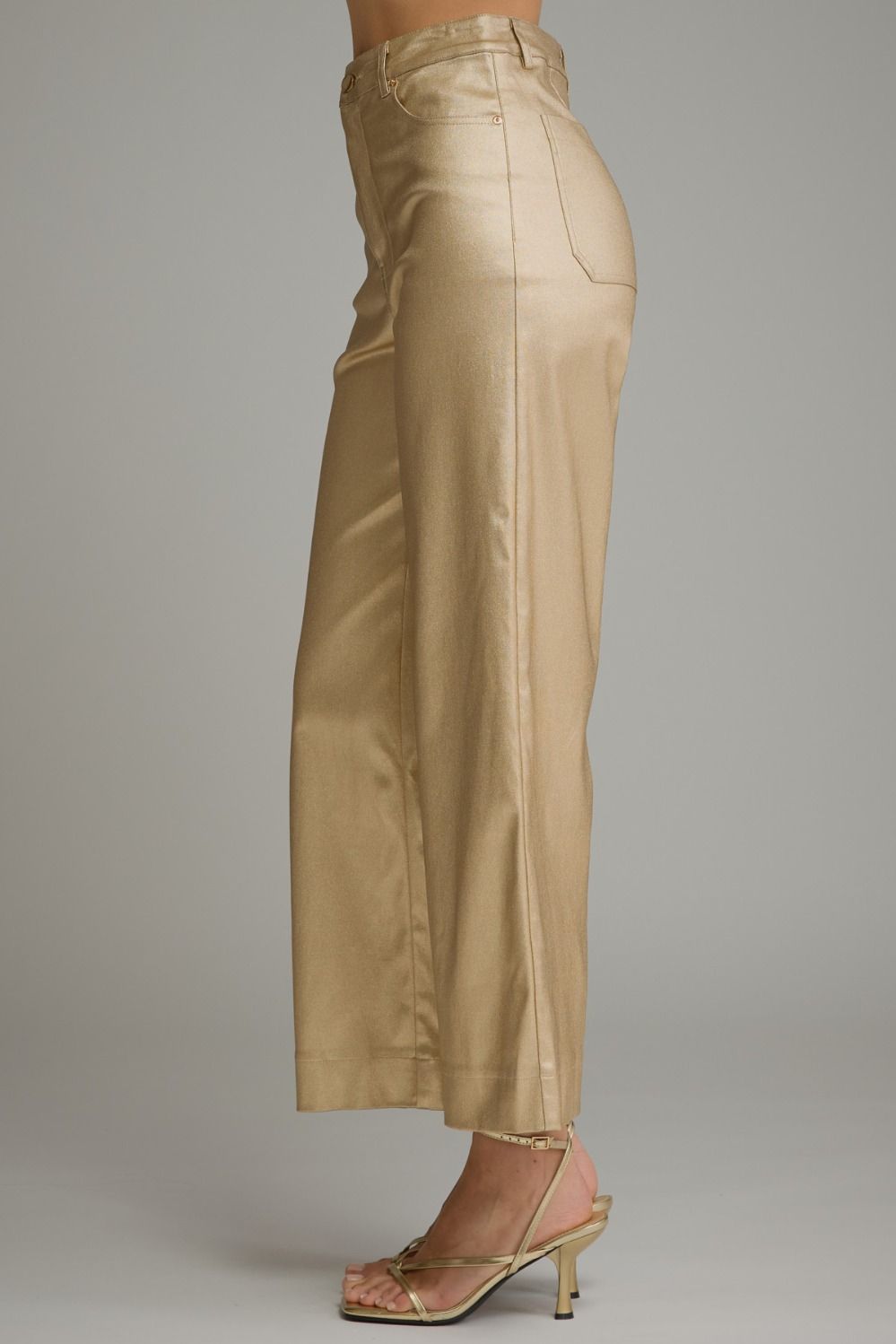 Side view of gold metallic wide leg pants